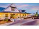 Stunning exterior view of the Lakehouse featuring a covered porch, stylish accents, and professional landscaping at 172 Helena Park Dr, Summerville, SC 29486