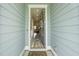 Inviting entryway offers a glimpse into a beautifully decorated home with a wood floor, rug runner, and neutral color palette at 172 Helena Park Dr, Summerville, SC 29486