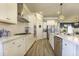 Contemporary white kitchen with stainless steel appliances, ample counter space, and modern lighting at 172 Helena Park Dr, Summerville, SC 29486