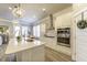 Bright kitchen with an island, stainless steel appliances, and wood grain flooring at 172 Helena Park Dr, Summerville, SC 29486