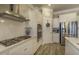 Bright kitchen with stainless steel appliances and wood grain flooring at 172 Helena Park Dr, Summerville, SC 29486