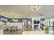 Open living room with hardwood floors, stylish decor, fireplace, and an adjacent dining area at 172 Helena Park Dr, Summerville, SC 29486