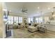 Bright living room features a comfortable sectional couch and an open layout to the kitchen at 172 Helena Park Dr, Summerville, SC 29486
