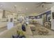 Open-concept living room with an inviting sectional sofa and view of the bright kitchen and dining areas at 172 Helena Park Dr, Summerville, SC 29486