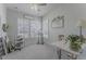 Bright and airy office with three windows, neutral walls, and an art station for creative projects and hobbies at 172 Helena Park Dr, Summerville, SC 29486
