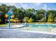 A relaxing pool featuring fun fountains, lounge chairs, picnic tables, and lush surroundings at 172 Helena Park Dr, Summerville, SC 29486