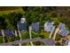 An aerial view of several homes with well-maintained lawns and mature landscaping at 1721 Bowline Dr, Mount Pleasant, SC 29466
