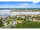 An aerial view showcasing a waterfront neighborhood with marshes, ponds, and lush vegetation at 1721 Bowline Dr, Mount Pleasant, SC 29466