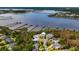 A stunning aerial view of waterfront homes with private boat docks and a scenic bridge in the background at 1721 Bowline Dr, Mount Pleasant, SC 29466