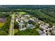 A stunning aerial view of a community, showing the tennis courts, swimming pools and beautiful landscaping at 1721 Bowline Dr, Mount Pleasant, SC 29466