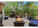 Beautiful backyard featuring a fire pit, lush greenery, an outdoor kitchen, and a water feature at 1721 Bowline Dr, Mount Pleasant, SC 29466