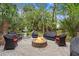 Inviting backyard with a cozy firepit, water fountain and comfortable seating area for entertaining at 1721 Bowline Dr, Mount Pleasant, SC 29466
