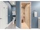 Bathroom featuring tiled shower, a toilet and storage, and white cabinets at 1721 Bowline Dr, Mount Pleasant, SC 29466