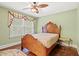 Cozy bedroom with a wood-framed bed, a decorative window with valances, and hardwood floors at 1721 Bowline Dr, Mount Pleasant, SC 29466