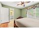A well-lit bedroom features a doorway to the bathroom and a decorative window at 1721 Bowline Dr, Mount Pleasant, SC 29466