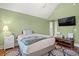 Spacious bedroom features hardwood floors, a ceiling fan, and ensuite bathroom at 1721 Bowline Dr, Mount Pleasant, SC 29466