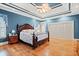 Bedroom with hardwood floors, tray ceilings, and bright blue walls at 1721 Bowline Dr, Mount Pleasant, SC 29466