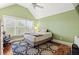 This bedroom features a ceiling fan, a large window, and neutral decor at 1721 Bowline Dr, Mount Pleasant, SC 29466