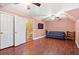 Spacious bonus room with wood flooring, a ceiling fan, and a comfortable sofa at 1721 Bowline Dr, Mount Pleasant, SC 29466