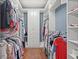 Walk-in closet with custom shelving, hanging rods, and wood floor at 1721 Bowline Dr, Mount Pleasant, SC 29466