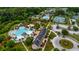 Aerial view of a community pool with a water slide, lush landscaping, and multiple seating areas at 1721 Bowline Dr, Mount Pleasant, SC 29466