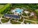 Large community pool aerial view showing a clubhouse, tennis courts, and mature landscaping at 1721 Bowline Dr, Mount Pleasant, SC 29466