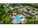 Aerial view of a large community pool, clubhouse, and tennis courts surrounded by trees at 1721 Bowline Dr, Mount Pleasant, SC 29466