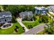 Aerial view of a two-story home featuring mature landscaping, a long driveway and a well-manicured lawn at 1721 Bowline Dr, Mount Pleasant, SC 29466