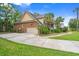 Spacious home featuring a two-car garage, a lush lawn, and beautiful landscaping at 1721 Bowline Dr, Mount Pleasant, SC 29466