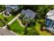 A bird's eye view of a two-story home with a long driveway, mature landscaping and manicured yard at 1721 Bowline Dr, Mount Pleasant, SC 29466