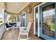 Charming front porch featuring rocking chairs, brick accents, and a tiled floor at 1721 Bowline Dr, Mount Pleasant, SC 29466