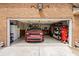 Spacious garage with ample storage, shelving, and a parked red Durango SUV, with well-lit interiors at 1721 Bowline Dr, Mount Pleasant, SC 29466