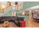 Spacious living room with hardwood floors, large sectional couch, and view into the kitchen at 1721 Bowline Dr, Mount Pleasant, SC 29466