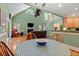 Open living space showcasing a fireplace, staircase, and view into the dining area at 1721 Bowline Dr, Mount Pleasant, SC 29466