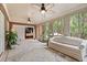 Bright sunroom with brick accent wall, tile floors, and large windows with backyard views at 1721 Bowline Dr, Mount Pleasant, SC 29466
