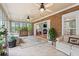 Bright sunroom with tile flooring, comfortable seating, and a view to a brick wall at 1721 Bowline Dr, Mount Pleasant, SC 29466