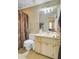 Bathroom featuring a toilet, shower and single sink vanity at 1830 Kempton Ave, James Island, SC 29412