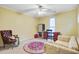 Bedroom featuring a ceiling fan, window and a red area rug at 1830 Kempton Ave, James Island, SC 29412