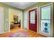 Foyer featuring hardwood floors, sidelight windows, and a stained glass front door at 1830 Kempton Ave, James Island, SC 29412