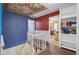 Upstairs hallway showcasing blue accent wall and built-in bookshelves at 1830 Kempton Ave, James Island, SC 29412
