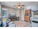 A living room features modern decor, a television, a small kitchen, and chairs at 1830 Kempton Ave, James Island, SC 29412
