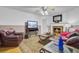 Cozy living room with fireplace, comfortable seating, and mounted television at 1830 Kempton Ave, James Island, SC 29412