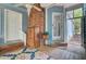 A screened porch featuring blue siding, brick features, and a blue rug at 1830 Kempton Ave, James Island, SC 29412