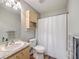 Cozy bathroom with neutral tones, vanity sink, and shower with white shower curtain at 188 Midland Pkwy # 516, Summerville, SC 29485