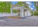 Car wash station with white lattice fence, door, and pressure washer at 188 Midland Pkwy # 516, Summerville, SC 29485