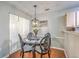 Cozy dining area with decorative lighting, and seating for four, creating a comfortable dining experience at 188 Midland Pkwy # 516, Summerville, SC 29485