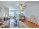 Inviting living room offering hardwood floors, ceiling fan, and ample seating to create a cozy living space at 188 Midland Pkwy # 516, Summerville, SC 29485