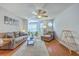 Comfortable living room featuring hardwood floors, ceiling fan, and neutral colors for a serene atmosphere at 188 Midland Pkwy # 516, Summerville, SC 29485