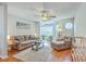Bright living room featuring hardwood floors, ceiling fan, and comfortable seating for relaxing or entertaining at 188 Midland Pkwy # 516, Summerville, SC 29485