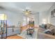 Spacious living room view into dining area featuring hardwood floors, neutral decor, and natural light at 188 Midland Pkwy # 516, Summerville, SC 29485